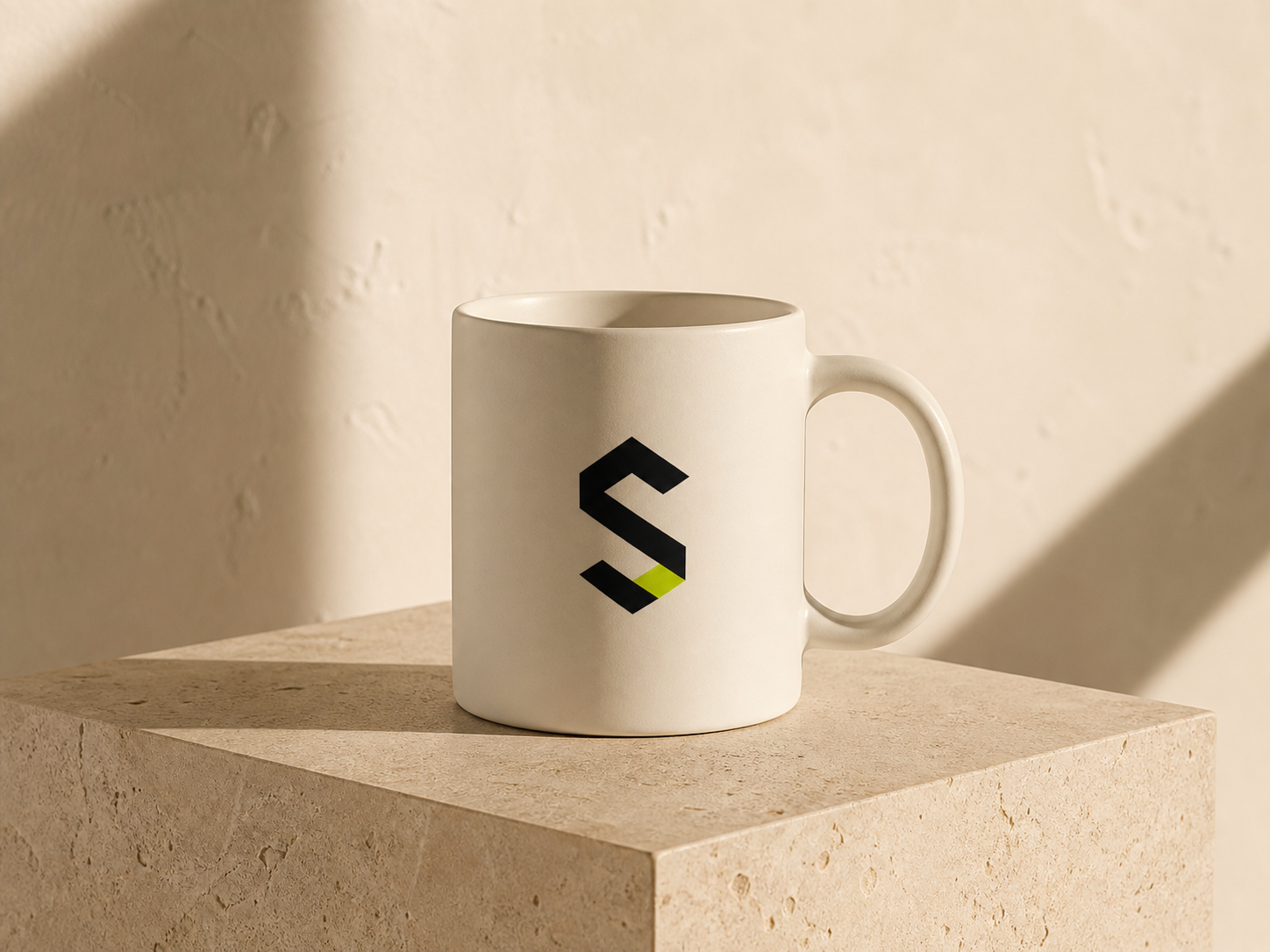 Minimal studio monogram applied to a ceramic mug